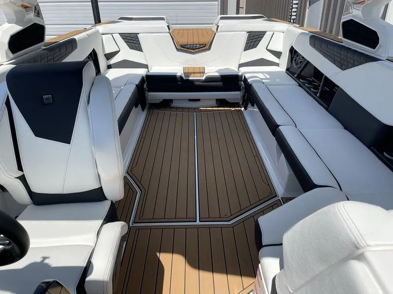 Slide: The Image of Interior of 2023 Nautique Super Air Nautique S25 boat with white and black seating. - 6
