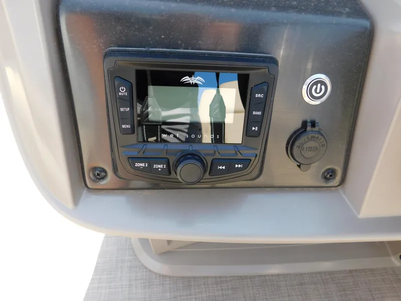 Slide: The Image of 2024 Sun Tracker Fishin' Barge 20 DLX control panel with media system. - 4