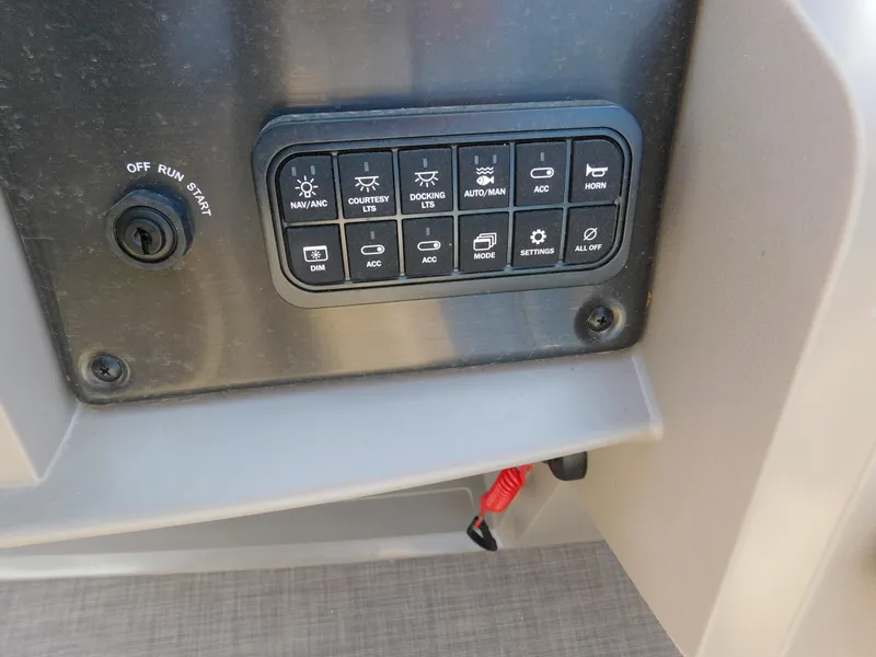 Slide: The Image of Control panel of a 2024 Sun Tracker Fishin' Barge 20 DLX boat. - 9