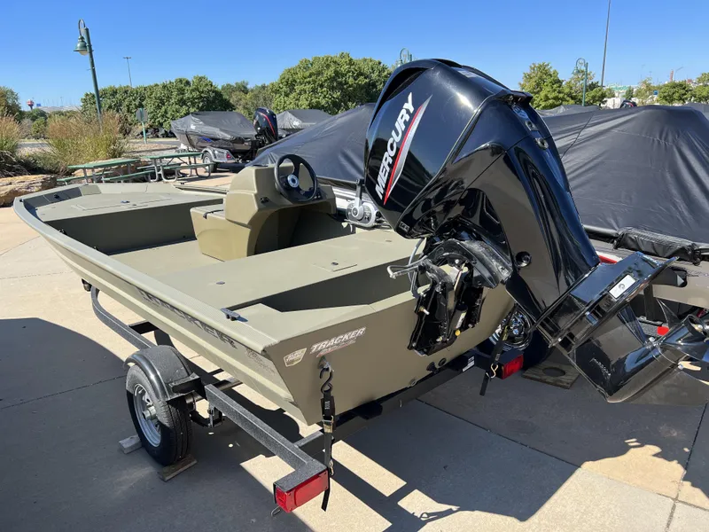 Slide: The Image of 2024 Tracker Grizzly 1648 SC boat with Mercury outboard motor on trailer. - 4