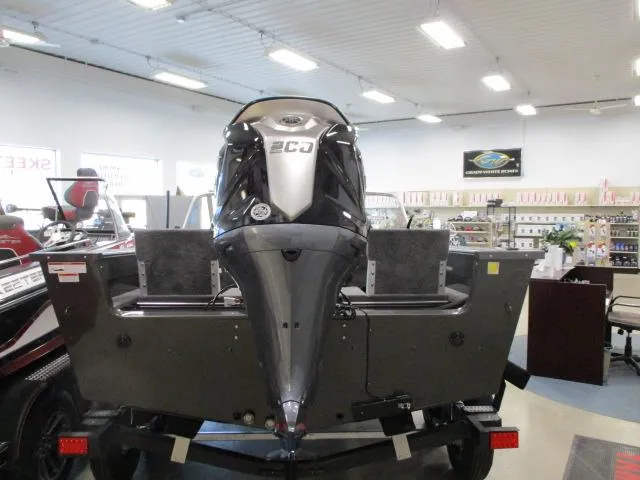 Slide: The Image of 2024 MirroCraft 1963 Aggressor boat in showroom, rear view. - 3