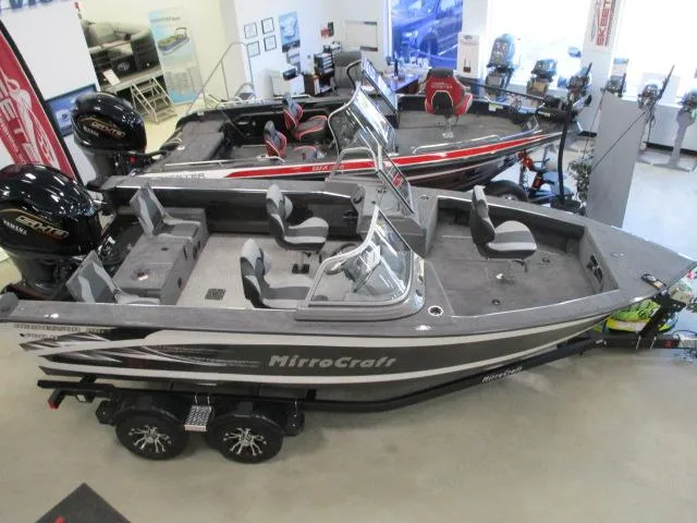 Slide: The Image of 2024 MirroCraft 1963 Aggressor boat displayed in a showroom. - 4