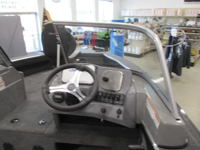 Slide: The Image of 2024 MirroCraft 1963 Aggressor boat interior, steering wheel, and control panel. - 5