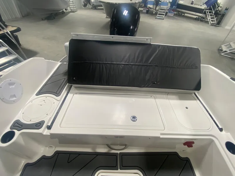 Slide: The Image of 2024 Bayliner Element M19 boat interior, rear seating and storage area. - 13