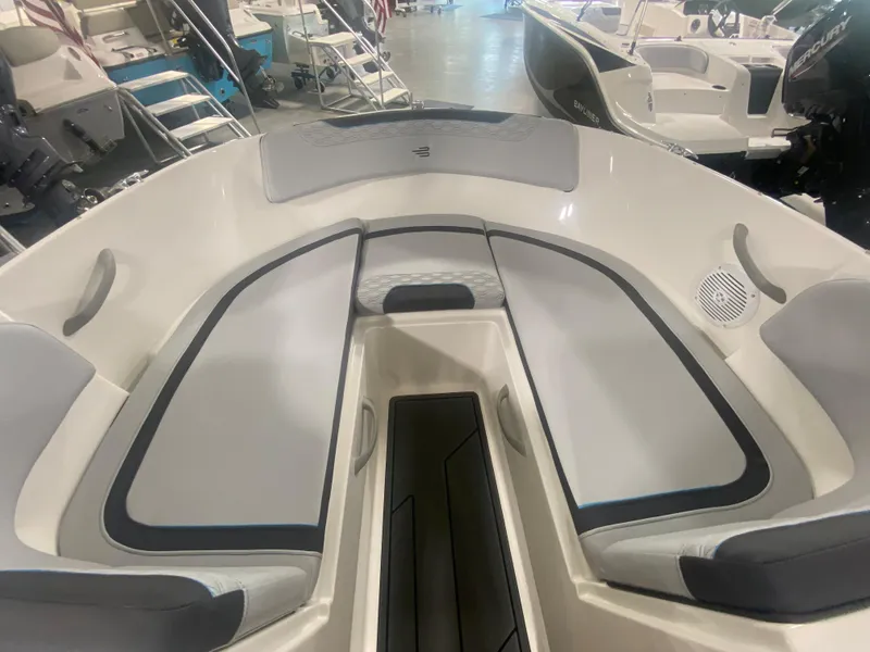 Slide: The Image of 2024 Bayliner Element M19 boat interior with cushioned seating and storage compartments. - 19