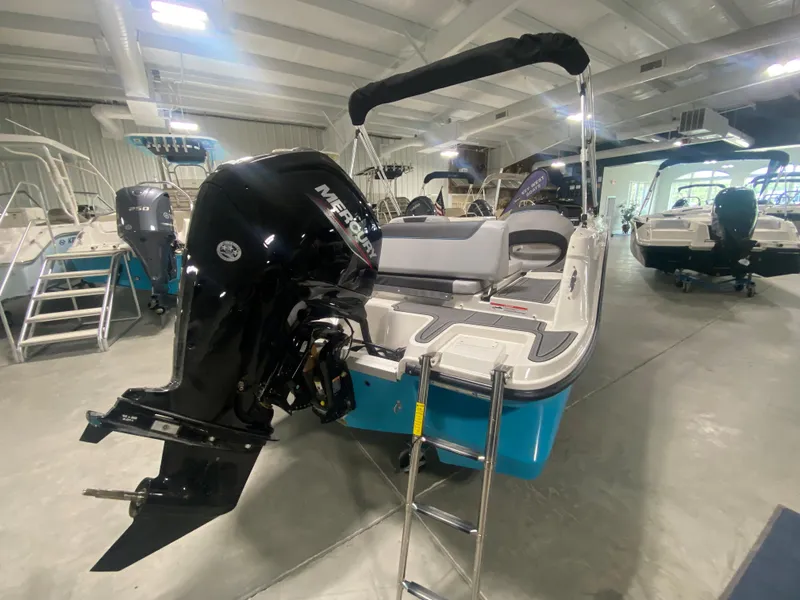 Slide: The Image of 2024 Bayliner Element M19 boat with Mercury outboard motor in showroom. - 5