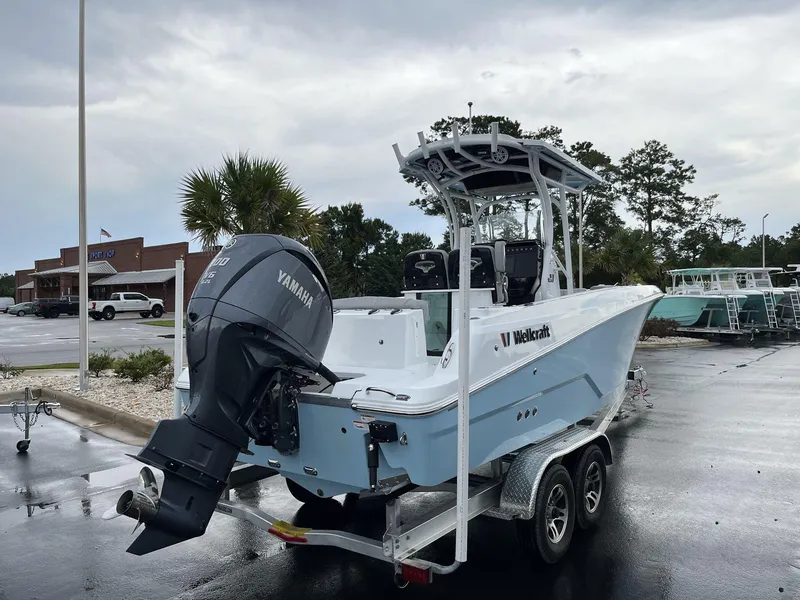 Slide: The Image of 2023 Wellcraft 242 Fisherman boat on a trailer with Yamaha outboard motor. - 3
