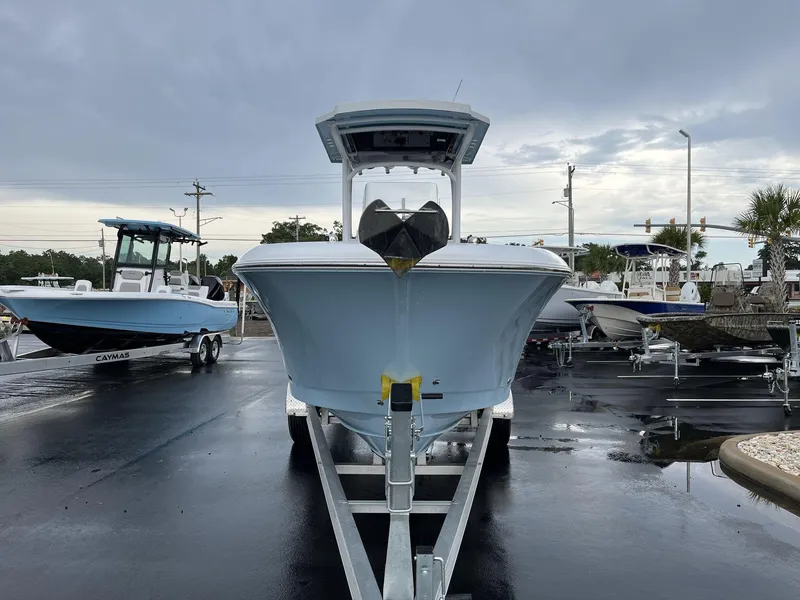 Slide: The Image of 2023 Wellcraft 242 Fisherman boat on trailer in a parking lot. - 4