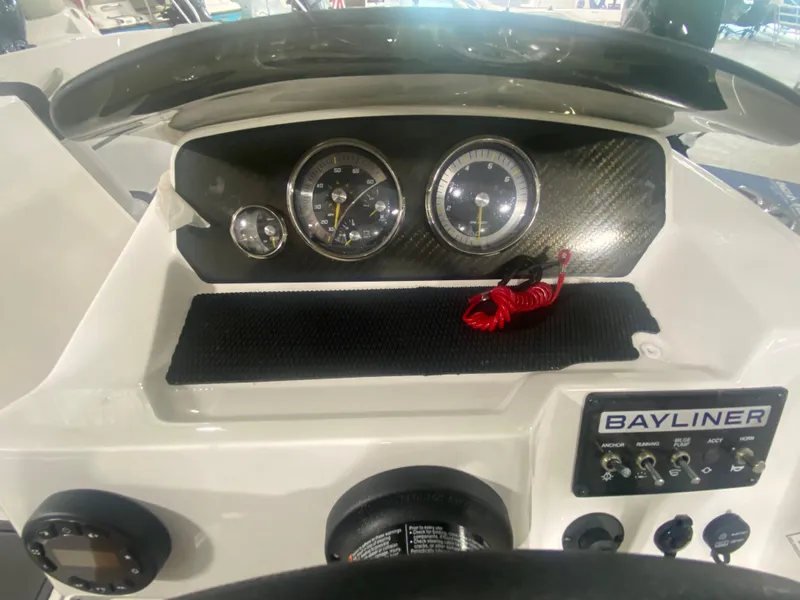Slide: The Image of 2024 Bayliner Element M19 dashboard with gauges and controls. - 16
