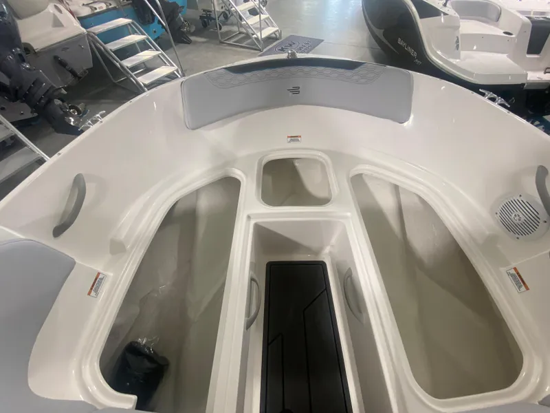 Slide: The Image of 2024 Bayliner Element M19 boat interior with storage compartments and seating. - 20