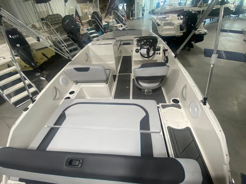 Slide: The Image of 2024 Bayliner Element M19 boat interior with seating and steering console. - 6