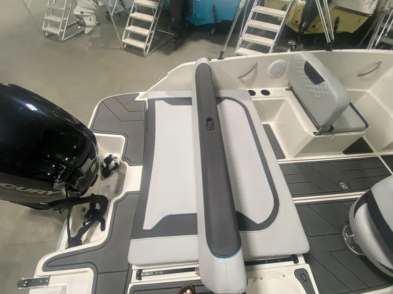 Slide: The Image of 2024 Bayliner Element M19 boat interior with seating and Mercury outboard motor. - 9
