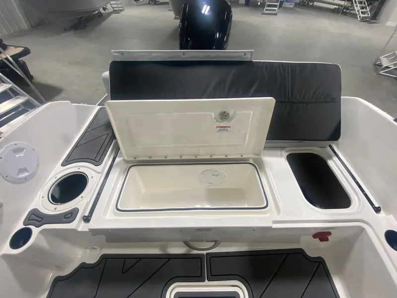 Slide: The Image of 2024 Bayliner Element M19 boat interior with open storage compartments. - 11