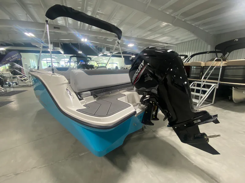 Slide: The Image of 2024 Bayliner Element M19 boat with Mercury outboard motor in showroom. - 4