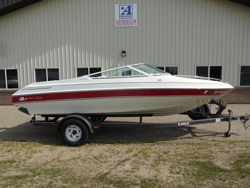 The Image of 1993 Chris-Craft 197 Concept boat on trailer outside showroom. - 1