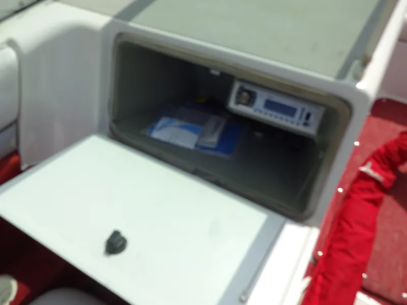 Slide: The Image of Open storage compartment in a 1993 Chris-Craft 197 Concept boat. - 13