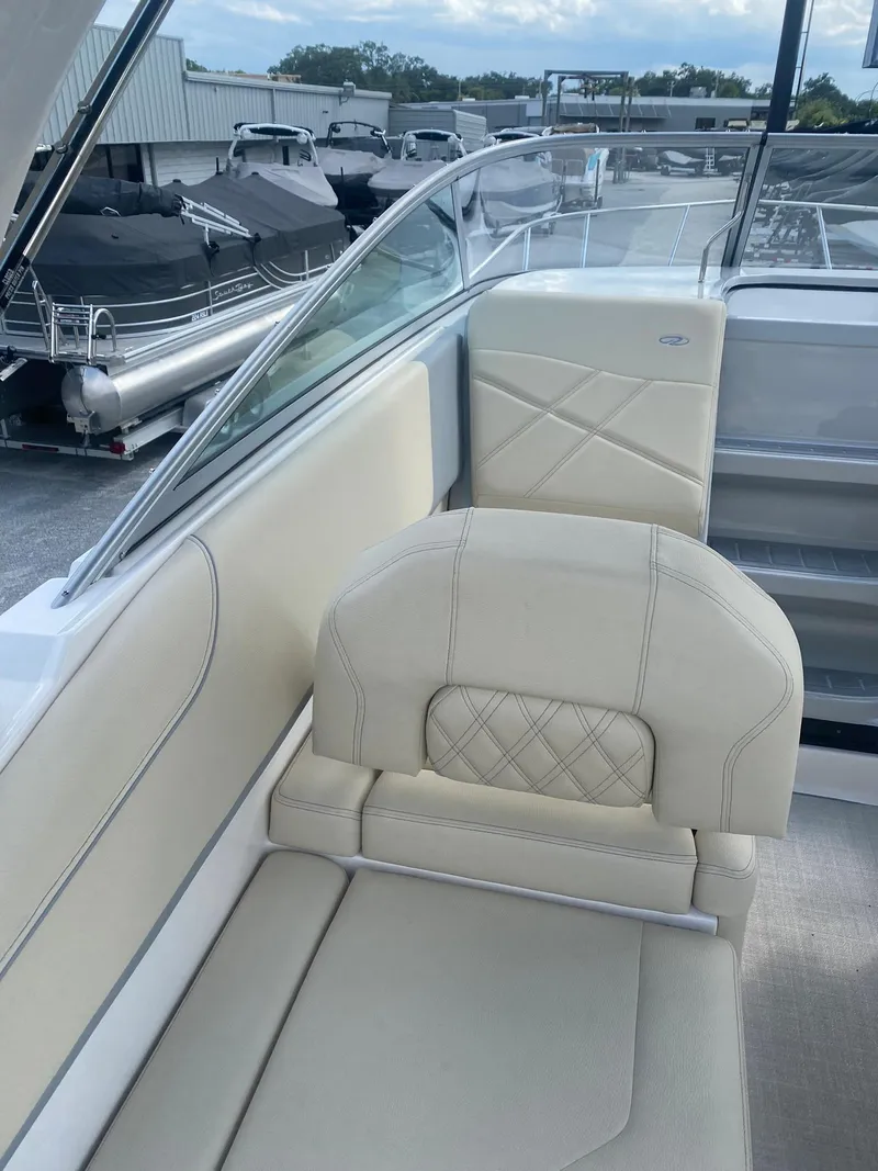 Slide: The Image of 2024 Regal 26 XO boat interior with beige seating and modern design. - 6