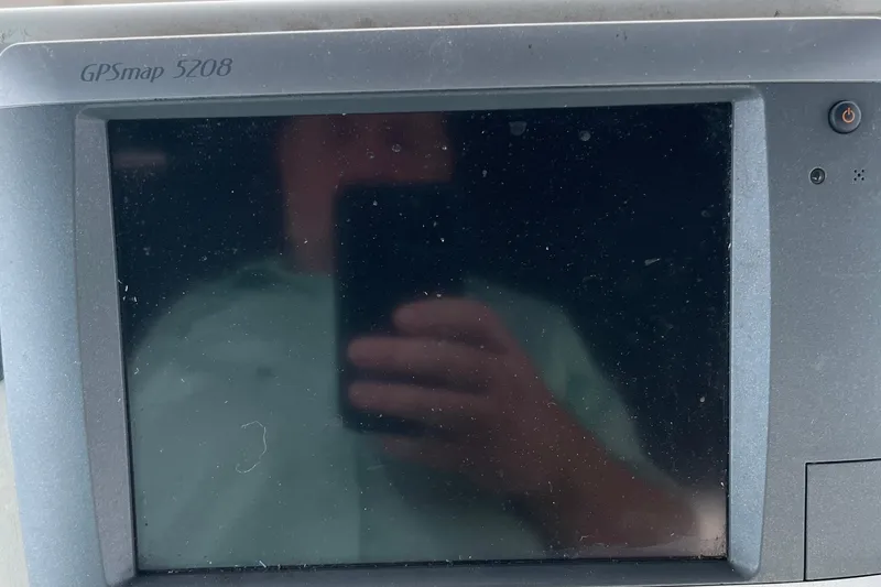 Slide: The Image of GPSmap 5208 display on 1996 Carver 400 Cockpit Motor Yacht, showing reflection. - 24