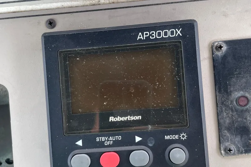 Slide: The Image of Control panel of Robertson AP3000X on 1996 Carver 400 Cockpit Motor Yacht. - 25