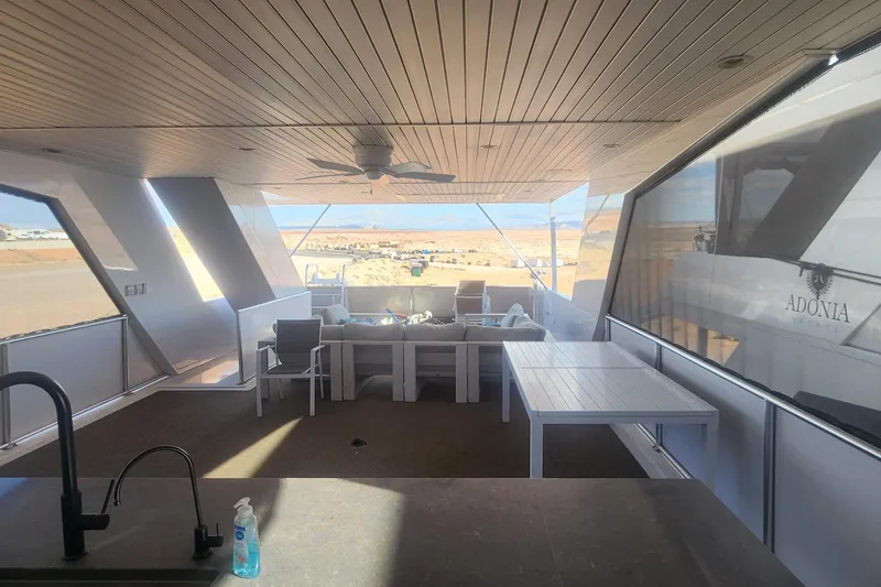 Slide: The Image of Luxurious Adonia Legacy Share #8 yacht interior, featuring modern seating and dining area, 2022 model. - 27