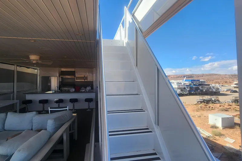Slide: The Image of Interior of 2022 Adonia Legacy Share #8 houseboat with stairs and modern kitchen. - 28