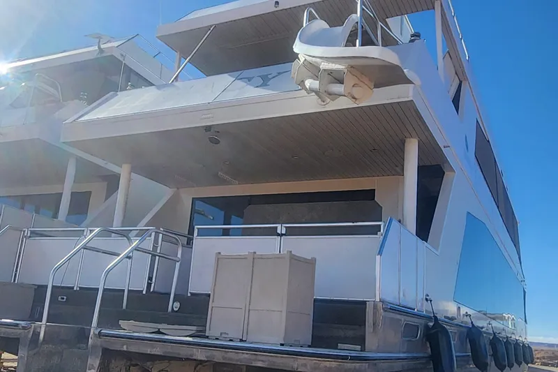 Slide: The Image of Luxury Adonia Legacy Share #8 houseboat, 2022 model, docked under clear blue sky. - 9