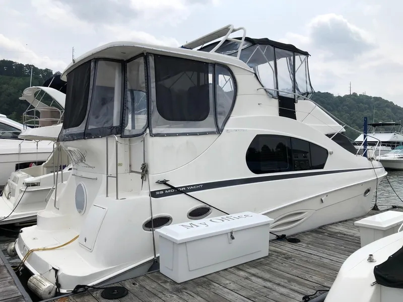 The Image of 2003 Silverton 35 Motor Yacht docked at a marina. - 1