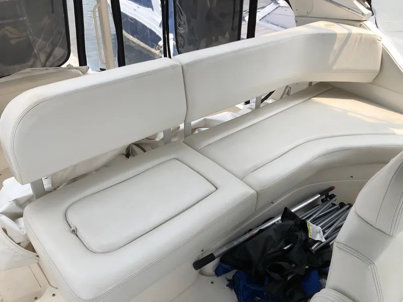 Slide: The Image of 2003 Silverton 35 Motor Yacht interior seating area with white leather upholstery. - 13