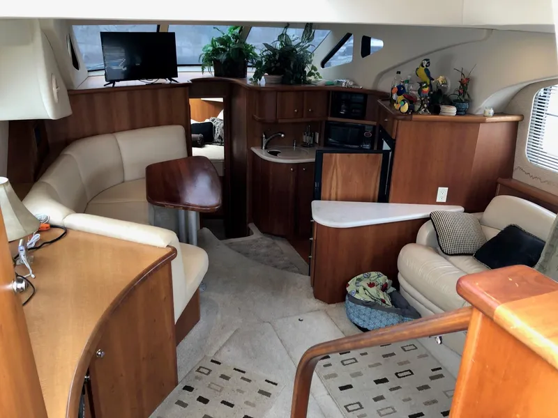 Slide: The Image of Interior of a 2003 Silverton 35 Motor Yacht with cozy seating and modern amenities. - 14