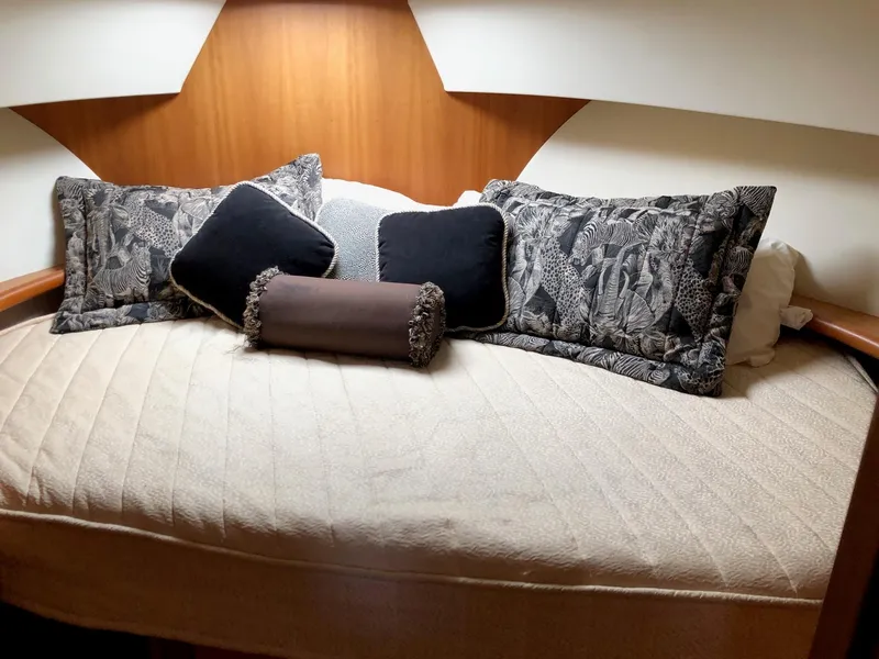 Slide: The Image of Luxurious bedroom in 2003 Silverton 35 Motor Yacht with plush pillows and cozy bedding. - 21