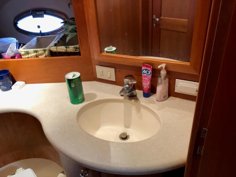 Slide: The Image of Bathroom sink area in a 2003 Silverton 35 Motor Yacht. - 23