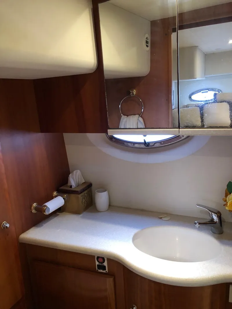 Slide: The Image of 2003 Silverton 35 Motor Yacht bathroom with sink and mirror. - 29