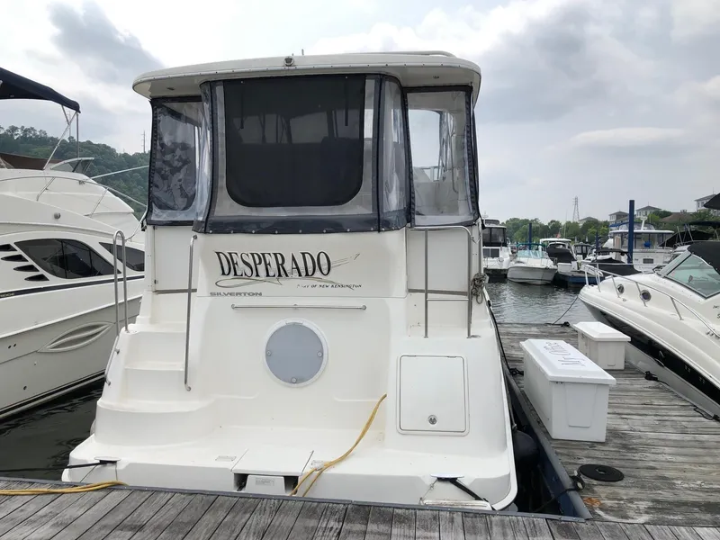 Slide: The Image of 2003 Silverton 35 Motor Yacht Desperado docked at marina. - 3