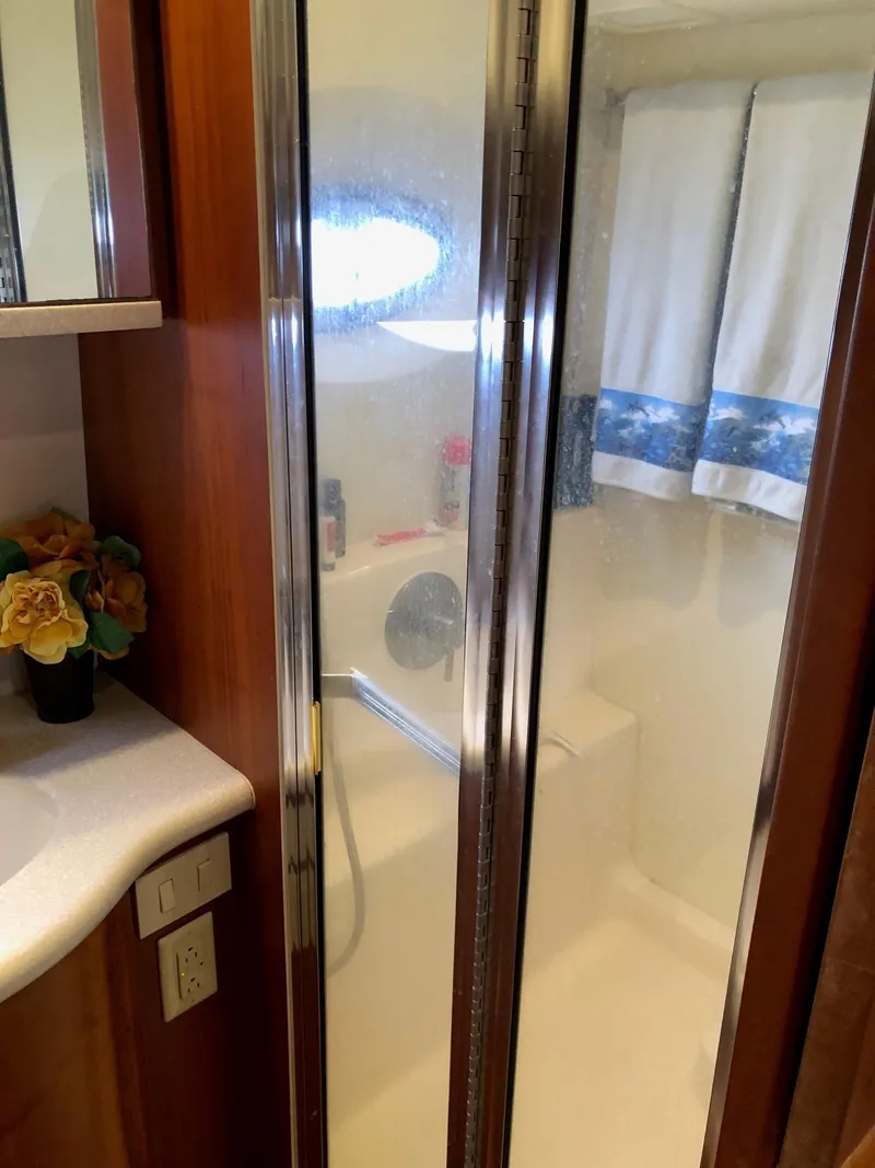 Slide: The Image of Bathroom shower area in a 2003 Silverton 35 Motor Yacht. - 30