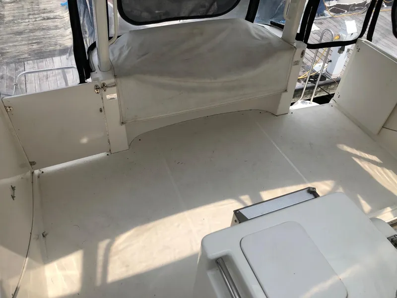 Slide: The Image of 2003 Silverton 35 Motor Yacht interior deck with seating area. - 4