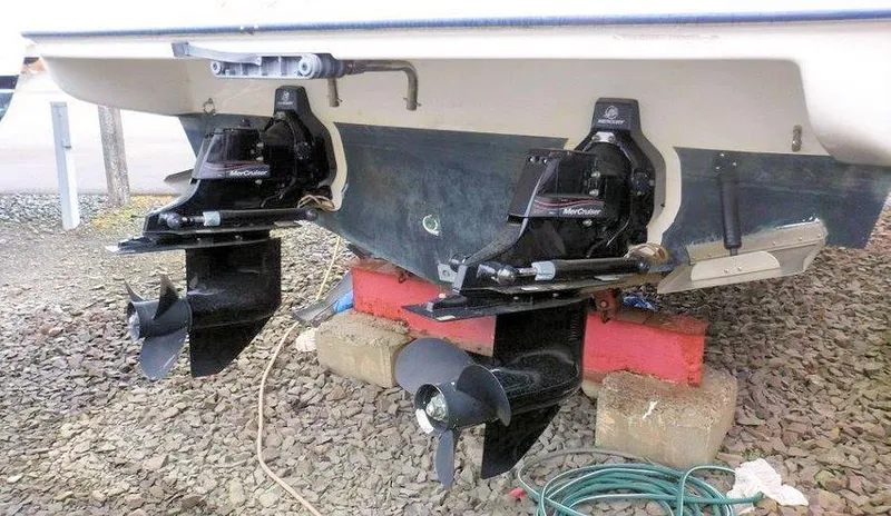 Slide: The Image of 2006 Bayliner 305 boat with dual outboard motors on dry dock. - 20