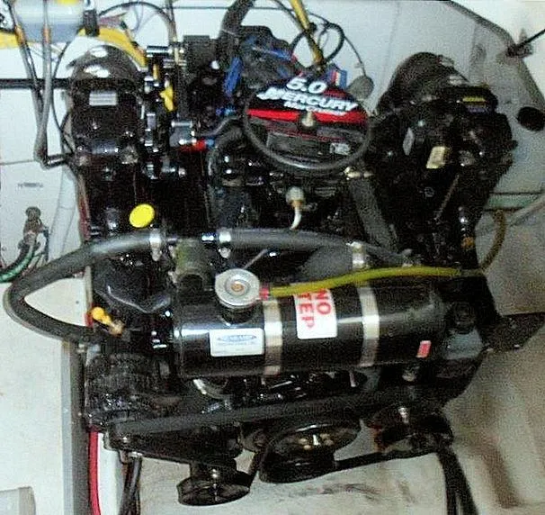 Slide: The Image of Engine of a 2006 Bayliner 305 boat, featuring a 5.0 Mercury motor. - 22