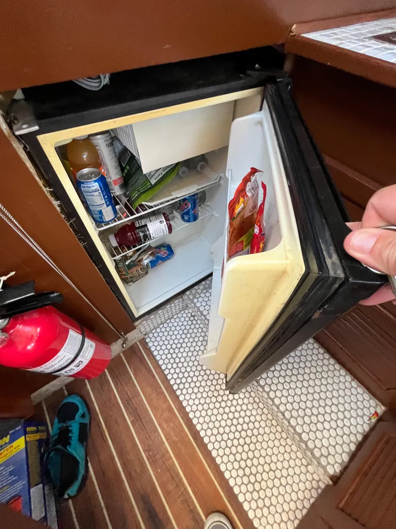Slide: The Image of Open fridge in 1987 Scand Baltic boat with drinks and snacks inside. - 17