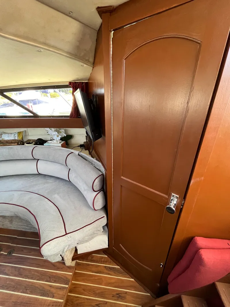 Slide: The Image of Interior of 1987 Scand Baltic boat with curved seating and wooden door. - 18