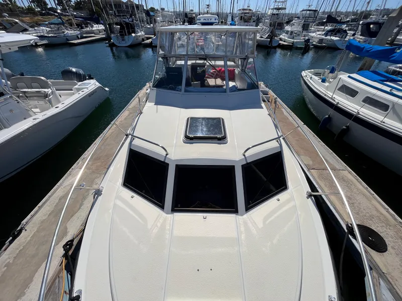 Slide: The Image of 1987 Scand Baltic boat docked at marina with other boats. - 3