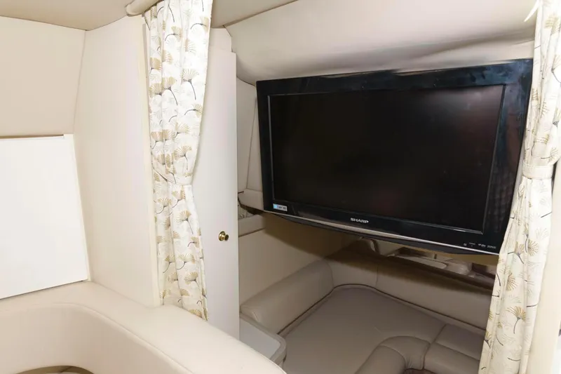 Slide: The Image of Interior of 2000 Formula 31 PC boat with TV and seating area. - 17