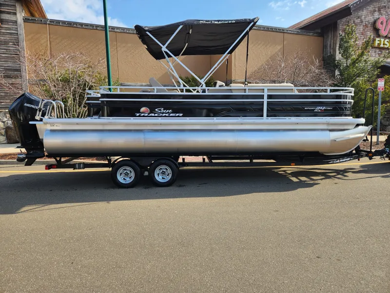 The Image of 2024 Sun Tracker Sportfish 24 XP3 pontoon boat on trailer. - 0