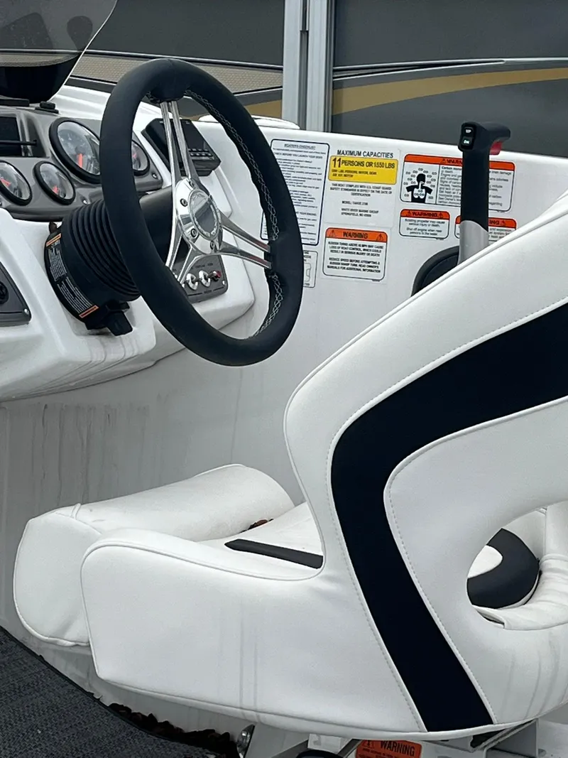 Slide: The Image of 2024 Tahoe 2150 boat cockpit with steering wheel and control panel. - 5