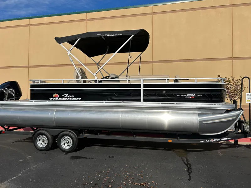 The Image of 2024 Sun Tracker Sportfish 24 XP3 pontoon boat on trailer. - 0