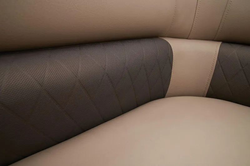 Slide: The Image of 2024 Sun Tracker Sportfish 24 XP3 beige and brown cushioned seating. - 48