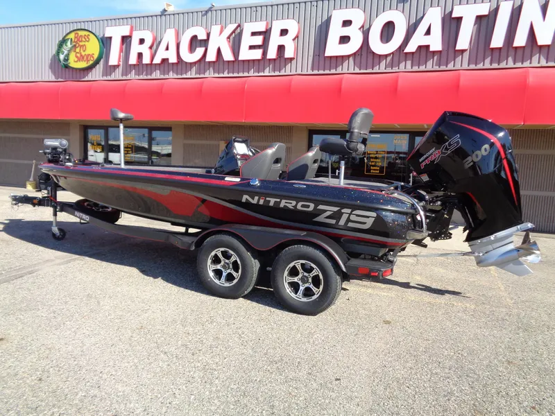 Slide: The Image of 2024 Nitro Z19 Pro boat displayed outside Tracker Boating store. - 2