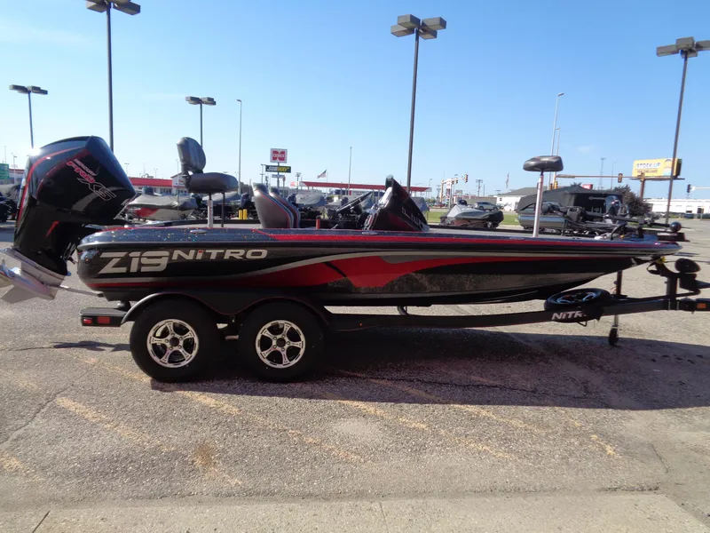 Slide: The Image of 2024 Nitro Z19 Pro fishing boat on trailer in outdoor dealership. - 3