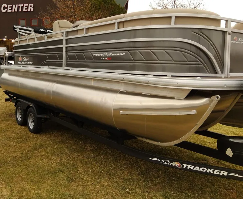 Slide: The Image of 2024 Sun Tracker Party Barge 22 RF XP3 pontoon boat on trailer. - 2