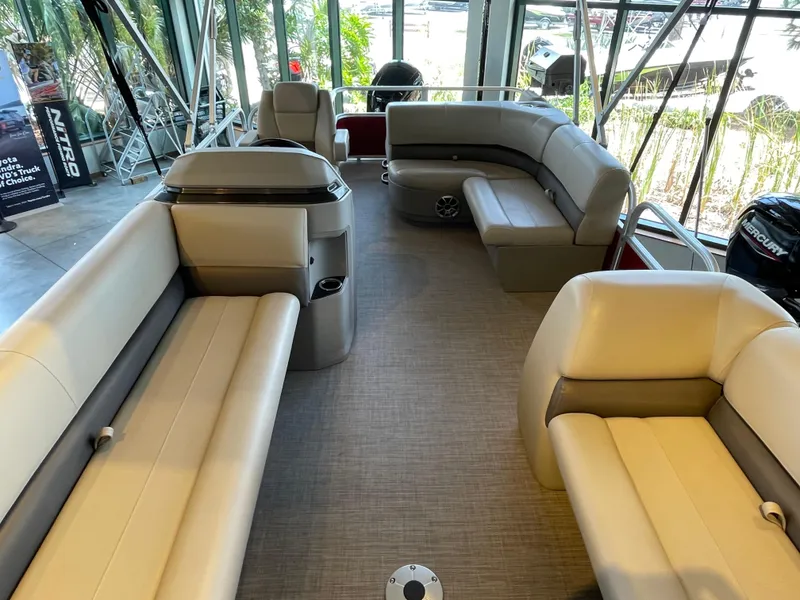 Slide: The Image of 2024 Sun Tracker Party Barge 18 DLX interior with spacious seating and modern design. - 2