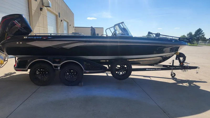 Slide: The Image of 2024 Ranger 621FS Ranger Cup Equipped boat on a trailer in a parking lot. - 3
